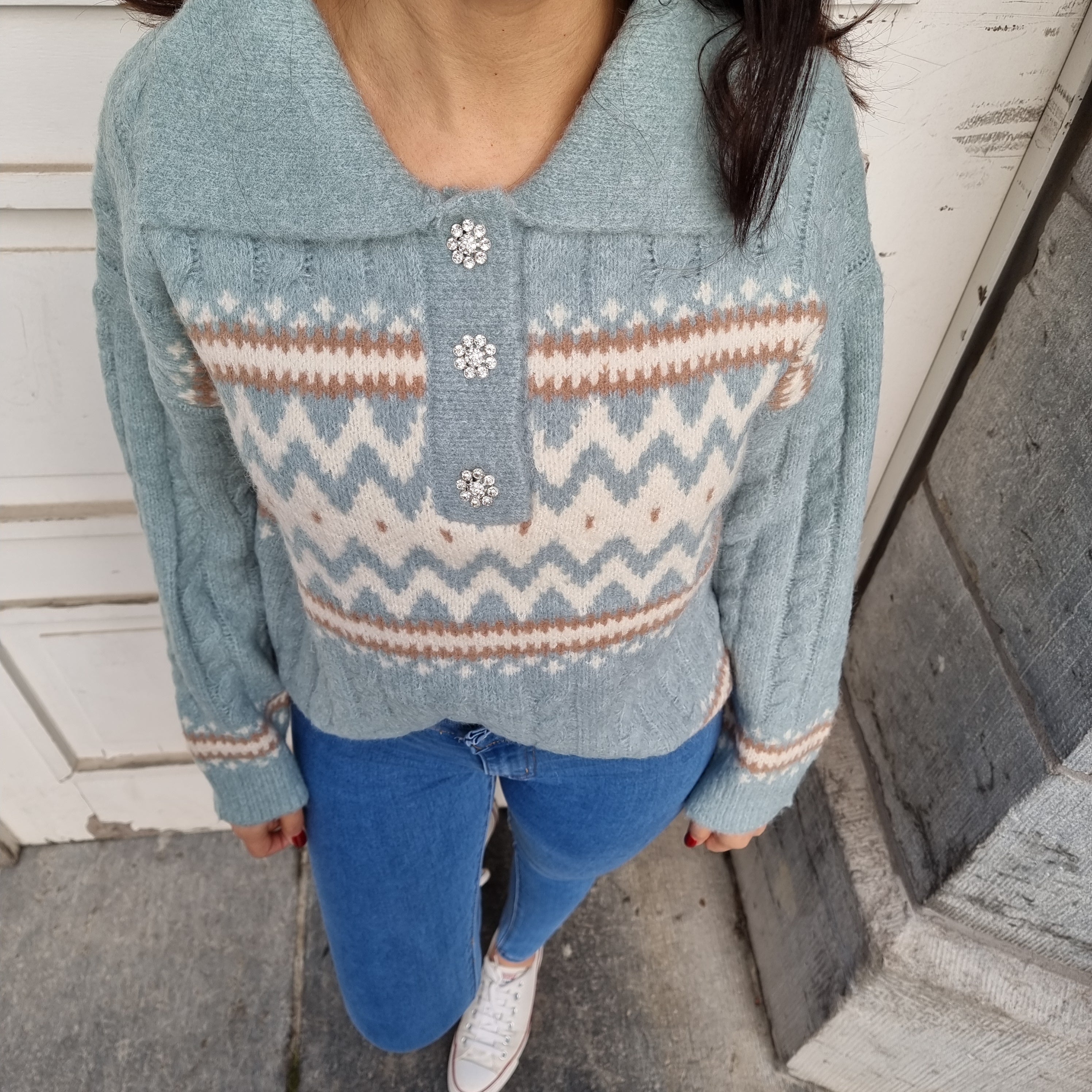 Light blue sweater with sparkly buttons