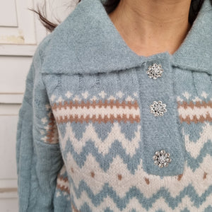 Light blue sweater with sparkly buttons